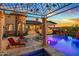Luxury pool with pergola, fire features, and mountain views at 10612 E Winter Sun Dr, Scottsdale, AZ 85262