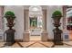 Elegant entryway with decorative urns and arched columns at 10612 E Winter Sun Dr, Scottsdale, AZ 85262