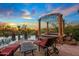 Relaxing pool area with pergola and comfortable lounge chairs at 10612 E Winter Sun Dr, Scottsdale, AZ 85262