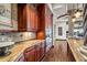Spacious kitchen with ample storage, granite countertops, and double ovens at 10612 E Winter Sun Dr, Scottsdale, AZ 85262