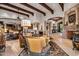 Open living area with a view of the kitchen and a large fireplace at 10612 E Winter Sun Dr, Scottsdale, AZ 85262