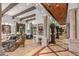 Spacious living room with high ceilings, hardwood floors, and a stone fireplace at 10612 E Winter Sun Dr, Scottsdale, AZ 85262