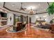 Large main bedroom with hardwood floors, fireplace, and sitting area with views at 10612 E Winter Sun Dr, Scottsdale, AZ 85262
