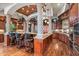 Island kitchen with granite counters, dark wood cabinets, and stainless steel appliances at 10612 E Winter Sun Dr, Scottsdale, AZ 85262