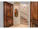 Unique spiral staircase with decorative stone and wood accents at 10612 E Winter Sun Dr, Scottsdale, AZ 85262