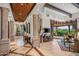 Open living area with tile floors, high ceilings, and access to outdoor patio at 10612 E Winter Sun Dr, Scottsdale, AZ 85262