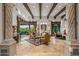 Grand living room with high ceilings, exposed beams, and comfortable seating at 10612 E Winter Sun Dr, Scottsdale, AZ 85262