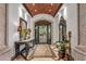 Elegant entry with high ceilings, ornate furniture, and a large mirror at 10612 E Winter Sun Dr, Scottsdale, AZ 85262
