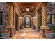 Grand entryway with ornate columns, arched entry, and brick ceiling at 10612 E Winter Sun Dr, Scottsdale, AZ 85262