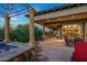 Spacious patio with a hot tub and access to the interior at 10612 E Winter Sun Dr, Scottsdale, AZ 85262