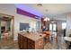 Kitchen with island, wood cabinets, and an open floor plan at 45298 W Sage Brush Dr, Maricopa, AZ 85139