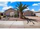 Single story home with a three car garage and desert landscaping at 43261 W Neely Dr, Maricopa, AZ 85138