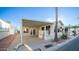 Inviting exterior with covered patio and well-maintained landscaping at 648 Hawks Eye Dr # 648, Apache Junction, AZ 85119