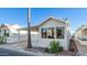 Mobile home with carport and landscaping at 648 Hawks Eye Dr # 648, Apache Junction, AZ 85119