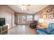 Living room with tiled floor, comfortable seating and access to patio at 648 Hawks Eye Dr # 648, Apache Junction, AZ 85119