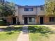 Front view of a two-story townhome with a grassy lawn at 6740 N 43Rd Ave, Glendale, AZ 85301