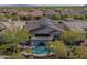 Aerial view showcasing the home's layout, pool, and surrounding neighborhood at 20960 W Mariposa St, Buckeye, AZ 85396