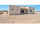 Rear view of house with patio and desert landscaping at 9121 W Debbie Ln, Arizona City, AZ 85123