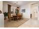 Formal dining room with wood table, chairs, and chandelier at 13431 W Los Bancos Dr, Sun City West, AZ 85375