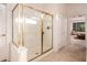 Bathroom with a large glass shower enclosure and tile floor at 13431 W Los Bancos Dr, Sun City West, AZ 85375