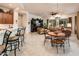 Open kitchen with breakfast bar and view of the living and dining areas at 13431 W Los Bancos Dr, Sun City West, AZ 85375