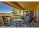 Balcony with table and chairs, overlooking golf course at 19466 N Star Ridge Dr, Sun City West, AZ 85375