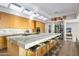 Gourmet kitchen boasts marble island, stainless steel appliances, and skylights at 10755 E Stoney Ln, Scottsdale, AZ 85262
