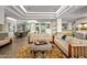 Spacious living room with multiple seating areas and large windows at 10755 E Stoney Ln, Scottsdale, AZ 85262