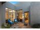 Relaxing patio with seating area and access to interior at 10755 E Stoney Ln, Scottsdale, AZ 85262