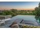 Infinity pool with spa and scenic golf course views at 10755 E Stoney Ln, Scottsdale, AZ 85262