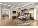 Bright main bedroom with hardwood floors and a view into the ensuite bathroom at 10755 E Stoney Ln, Scottsdale, AZ 85262