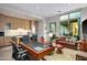 Home office with built-in desk and access to a private patio at 10755 E Stoney Ln, Scottsdale, AZ 85262