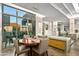 Elegant dining area with a round table and chairs, near the kitchen at 10755 E Stoney Ln, Scottsdale, AZ 85262