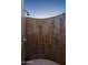 Modern outdoor shower with stone tile walls at 10755 E Stoney Ln, Scottsdale, AZ 85262