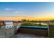 Outdoor kitchen with built-in grill and refrigerator, offering scenic views at 10755 E Stoney Ln, Scottsdale, AZ 85262