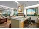 Home office with built-in desk and large windows offering scenic views at 10755 E Stoney Ln, Scottsdale, AZ 85262