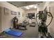 Home gym with a variety of cardio and strength training equipment at 10755 E Stoney Ln, Scottsdale, AZ 85262