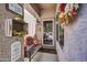 Inviting front porch with a bench and autumnal decorations at 44089 W Pioneer Rd, Maricopa, AZ 85139