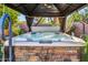 Enjoy this relaxing hot tub under a shaded gazebo at 44089 W Pioneer Rd, Maricopa, AZ 85139