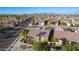 Aerial view showcasing a house's backyard and surrounding homes at 2607 E San Simeon Dr, Casa Grande, AZ 85194