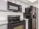 Kitchen with black appliances and gray cabinets at 16053 N 26Th Cir, Phoenix, AZ 85023
