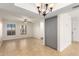 Open living room with tile floors and a chandelier at 16053 N 26Th Cir, Phoenix, AZ 85023