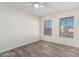 Spacious bedroom with wood-look floors and window views at 16053 N 26Th Cir, Phoenix, AZ 85023