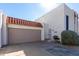 Townhouse exterior with attached garage and landscaping at 16053 N 26Th Cir, Phoenix, AZ 85023