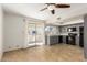 Bright kitchen with gray cabinets, black appliances, and tile floor at 16053 N 26Th Cir, Phoenix, AZ 85023