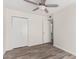 Bright bedroom with double door closet and wood-look flooring at 16053 N 26Th Cir, Phoenix, AZ 85023