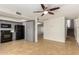 Open kitchen features gray cabinets, black appliances, and tile flooring at 16053 N 26Th Cir, Phoenix, AZ 85023