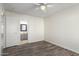 Bedroom with en-suite bathroom and wood-look floors at 16053 N 26Th Cir, Phoenix, AZ 85023