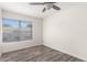 Well-lit bedroom with wood-look floors and window at 16053 N 26Th Cir, Phoenix, AZ 85023