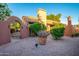 Landscaped backyard with gravel pathway and arch at 13128 N 104Th Pl, Scottsdale, AZ 85260